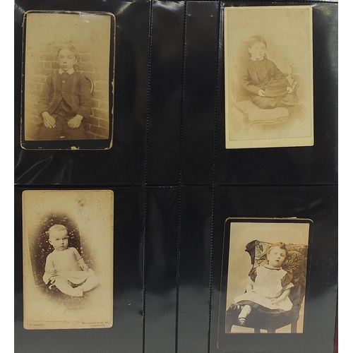 688 - Collection of Victorian cabinet cards arranged in three albums