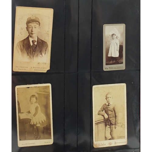 688 - Collection of Victorian cabinet cards arranged in three albums