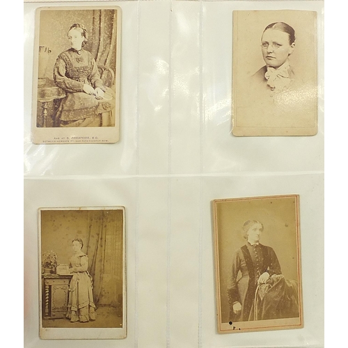 688 - Collection of Victorian cabinet cards arranged in three albums