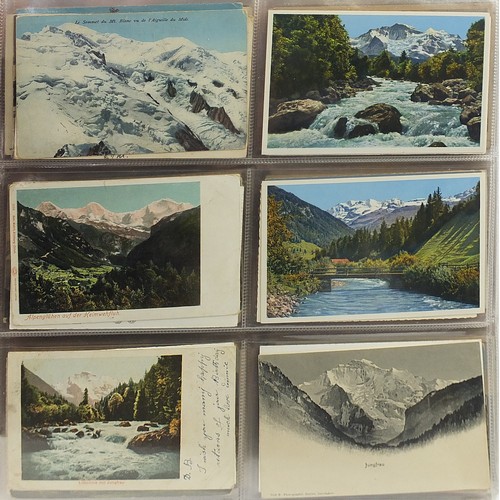 690 - Collection of continental topographical postcards arranged in an album, some black and white photogr... 