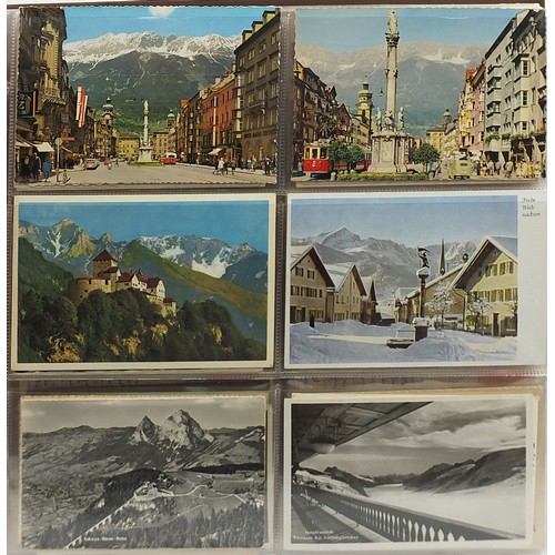 690 - Collection of continental topographical postcards arranged in an album, some black and white photogr... 