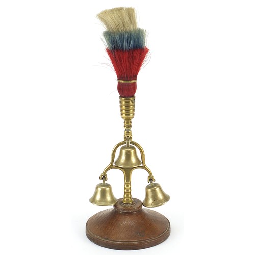 1251 - Brass horse bell swinger on wooden base, 32cm high