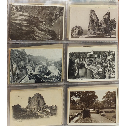 1360 - Collection of topographical and social history postcards arranged in an album, some black and white ... 