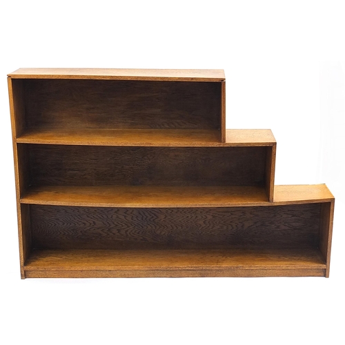 915 - Manner of Heals, Art Deco oak three shelf steps design open bookcase, 100.5cm H x 152cm W x 22cm D