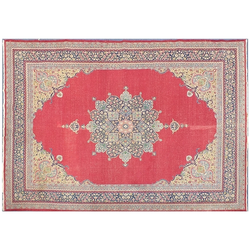 827 - Large red ground carpet having a all over floral design, 360cm x 270cm