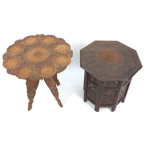 870 - Two Indian carved wood folding occasional tables, one profusely carved with fruit on a vine, 60cm hi... 