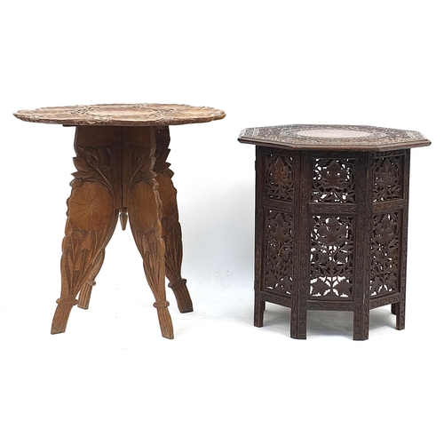 870 - Two Indian carved wood folding occasional tables, one profusely carved with fruit on a vine, 60cm hi... 