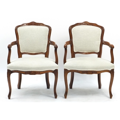 900 - Pair of French style mahogany framed open armchairs each  with cream upholstered back and seat, 84cm... 