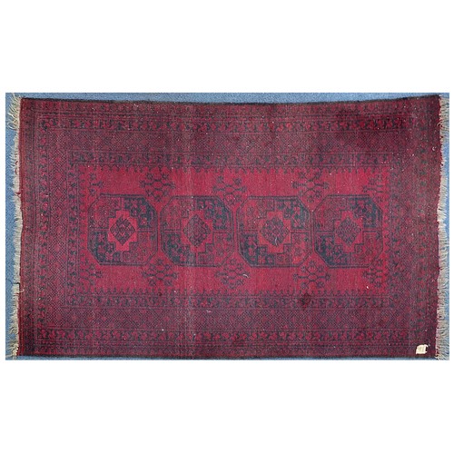 847 - Red and black ground rug having all over geometric design, 225cm x 145cm