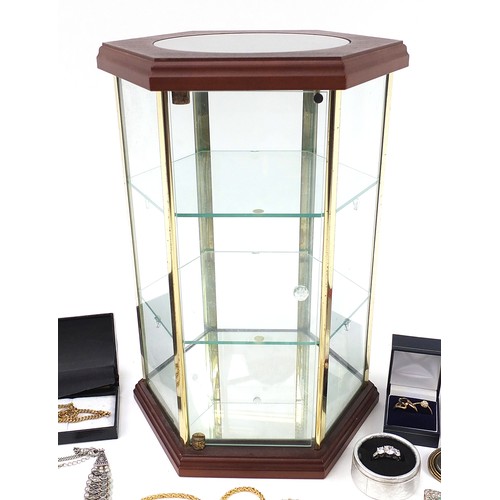 1360A - Costume jewellery and a glass display case, including rings, brooches and necklaces, the cabinet 33c... 