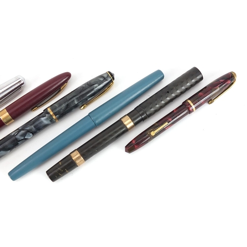 180 - Seven vintage fountain pens, five with gold nibs including Watermans with 9ct gold mounted body, Con... 