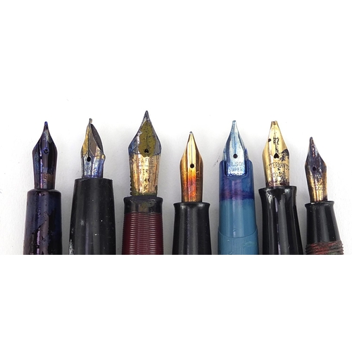 180 - Seven vintage fountain pens, five with gold nibs including Watermans with 9ct gold mounted body, Con... 