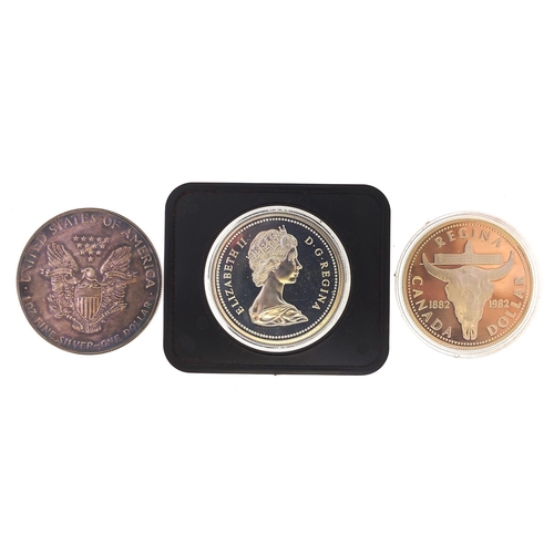 1595 - American and Canadian silver coinage comprising 1987 one ounce silver dollar, 1982 and 1974 Canadian... 