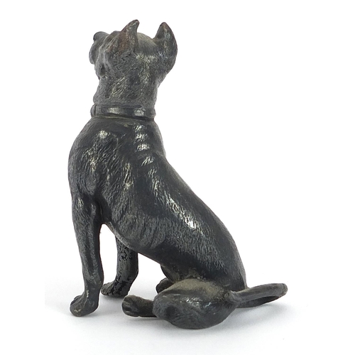 749 - WMF, German silver plated model of a seated dog, 7.5cm high