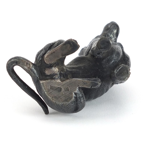 749 - WMF, German silver plated model of a seated dog, 7.5cm high