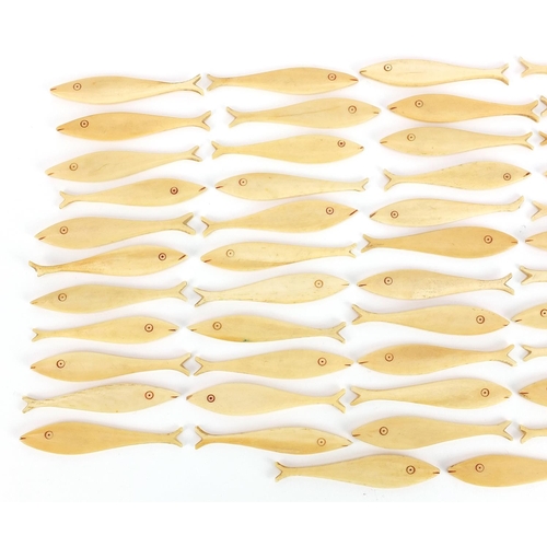 309 - Collection of antique carved bone fish gaming counters, each 6.5cm in length