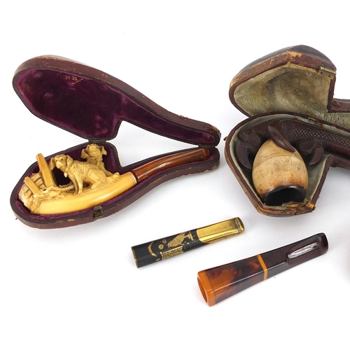 132 - Smoking pipes and cheroot holders including three Meerschaum type pipes, one carved in the form of a... 