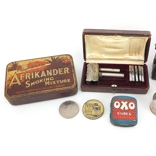 979 - Objects and sundry items including advertising tins, Zeiss Ikon baby box camera, blue opaline glass ... 