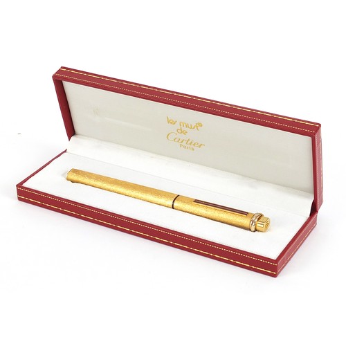 96 - Must de Cartier gold plated and enamel ballpoint pen with fitted case, guarantee wallet and box, the... 