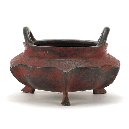 1014 - Chinese lacquered patinated bronze tripod censer with twin handles, four figure character marks to t... 