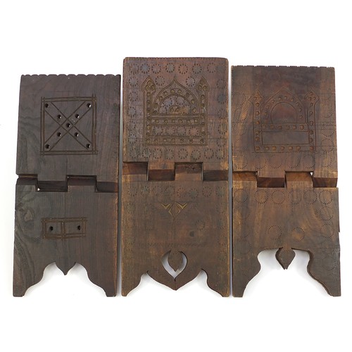 1047 - Three Islamic carved hardwood folding Quran stands including two carved with mosques, the largest 43... 