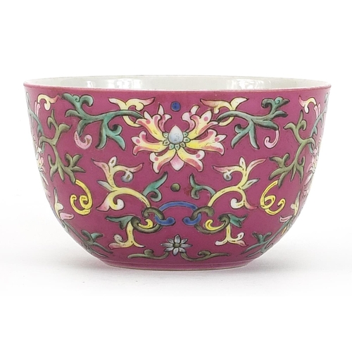 153 - Chinese porcelain pink ground bowl hand painted in the famille rose palette with flower heads amongs... 