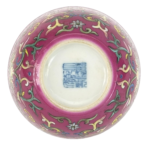 153 - Chinese porcelain pink ground bowl hand painted in the famille rose palette with flower heads amongs... 