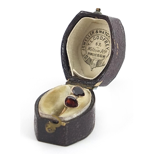 2053 - Antique unmarked gold garnet double tear drop ring housed in a T L Godfrey leather box, size I/J, 0.... 