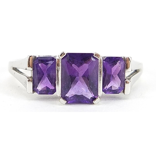 1738 - 9ct white gold amethyst three stone ring, size T, 2.8g