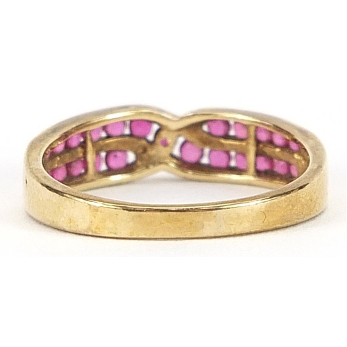 2022 - 9ct gold ruby crossover half eternity ring, size O, 2.2g