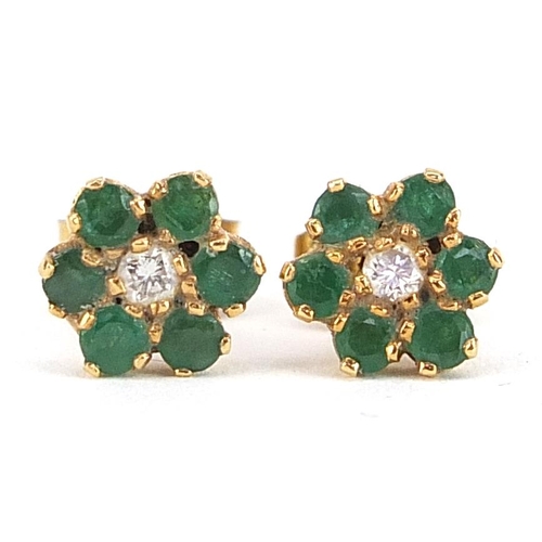 2135 - Pair of 9ct gold emerald and diamond flower head stud earrings, 7.5mm in diameter, 1.5g