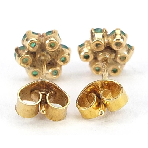 2135 - Pair of 9ct gold emerald and diamond flower head stud earrings, 7.5mm in diameter, 1.5g