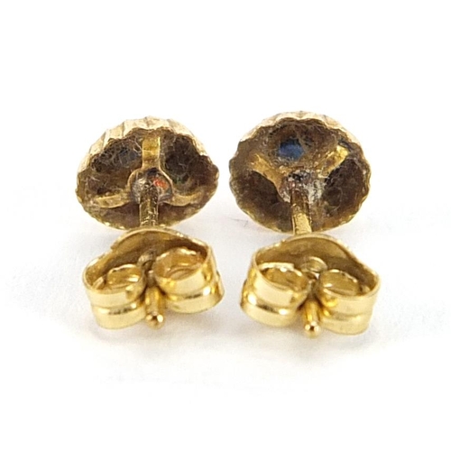 2038 - Pair of 9ct gold sapphire solitaire stud earrings, 5.5mm in diameter, 0.3g