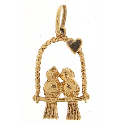 2056 - 9ct gold pair of love birds on a swing charm, 1.7cm high, 1.7g