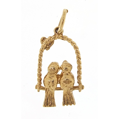 2056 - 9ct gold pair of love birds on a swing charm, 1.7cm high, 1.7g