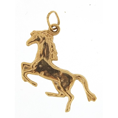 2011 - 9ct gold galloping horse charm, 2.2cm in length, 0.6g