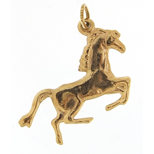 2011 - 9ct gold galloping horse charm, 2.2cm in length, 0.6g