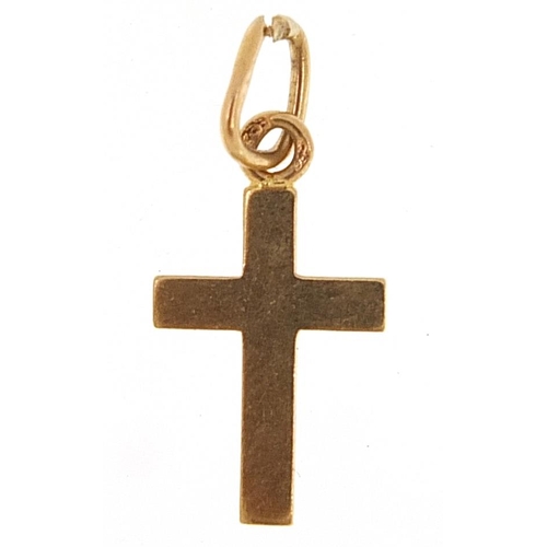 2132 - Continental gold cross charm, (tests as 15ct gold) indistinct marks, 1.5cm high, 0.6g