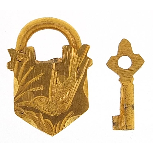 1736 - Yellow metal padlock and key jewellery clasp engraved with a bird 1.5cm high, 2.2g