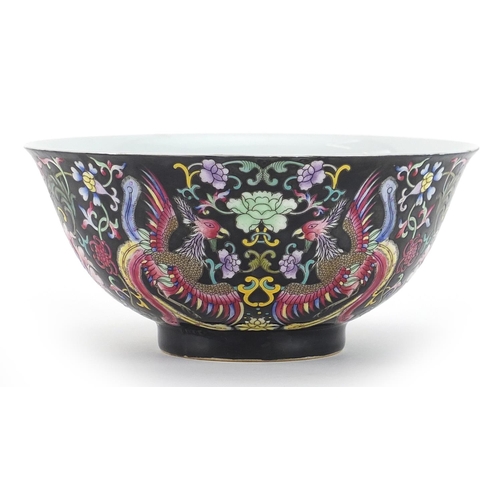 1113 - Chinese porcelain bowl hand painted in the famille noir palette with phoenixes amongst flowers, four... 