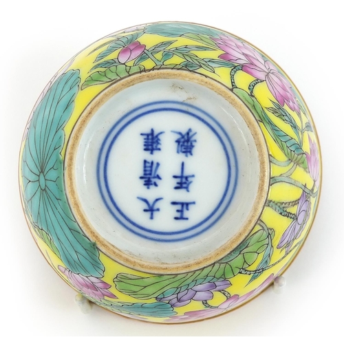 1205 - Chinese porcelain yellow ground bowl hand painted in the famille rose palette with flowers, six figu... 