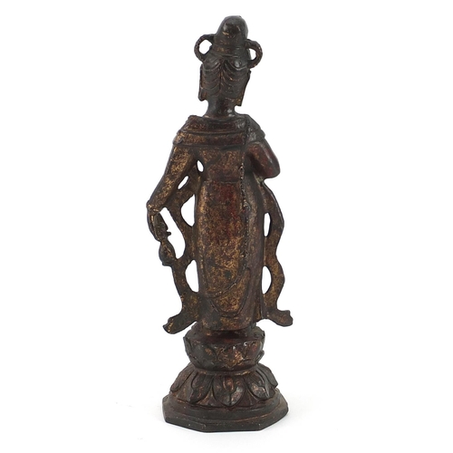 489 - Chino Tibetan partially gilt figure of a standing deity, 25cm high