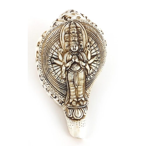 760 - Chino Tibetan conch shell carved with Buddha, 18cm in length