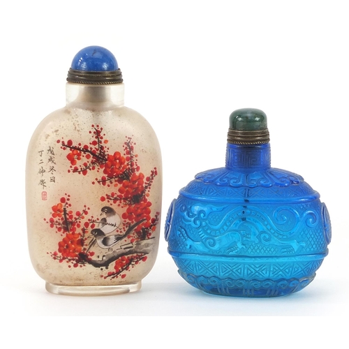 1006 - Two Chinese glass snuff bottles including one internally hand painted with birds amongst peony bloss... 