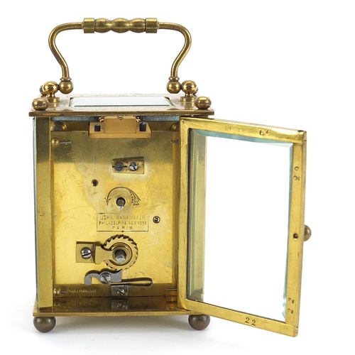 408 - John Wanamaker, 19th century brass cased carriage clock with enamelled dial having Arabic numerals a... 