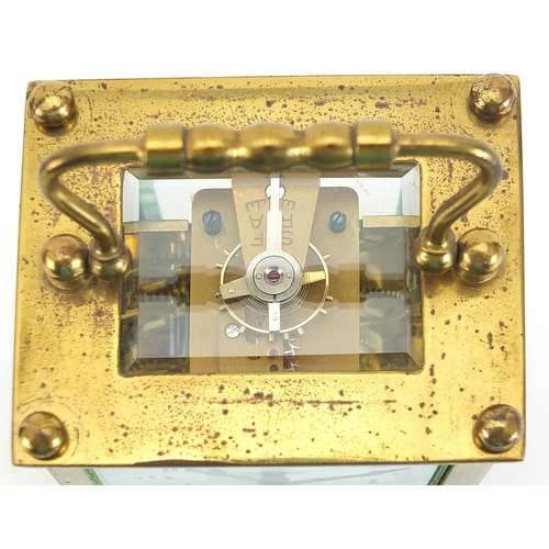 408 - John Wanamaker, 19th century brass cased carriage clock with enamelled dial having Arabic numerals a... 