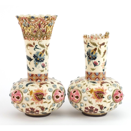 249 - Zsolnay Pecs, pair of Hungarian pottery vases with pierced rims hand painted with stylised flowers, ... 