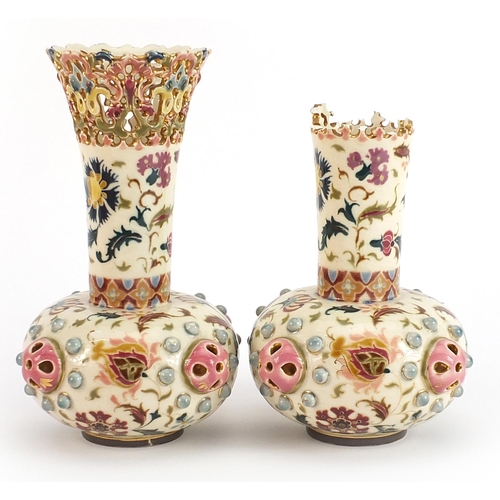 249 - Zsolnay Pecs, pair of Hungarian pottery vases with pierced rims hand painted with stylised flowers, ... 