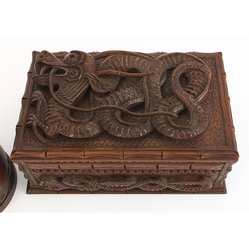 746 - Chinese hardwood casket deeply carved with a dragon together with a similar tankard, the largest 21c... 