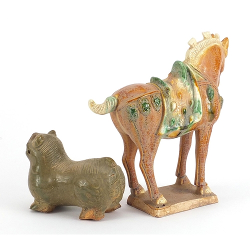 707 - Two Chinese pottery figures including a Tang style horse, the largest 20cm in length